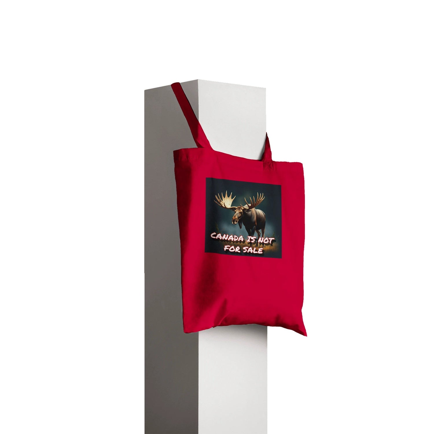 A picture Of a red tote back that says Canada is not for sale with a moose on it 